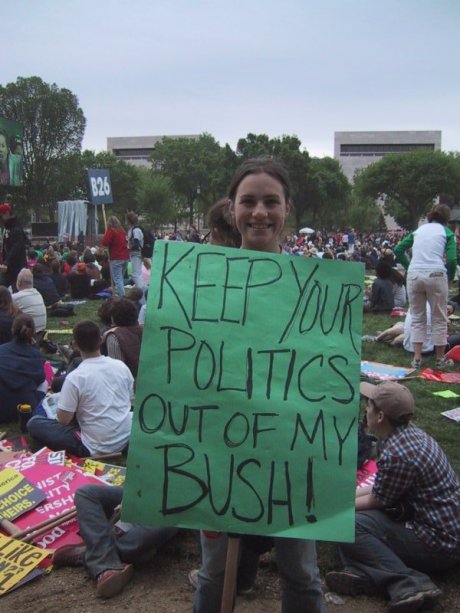 A female abortion supporter at an abortion rally holding a sign that says: "Keep Your Politics Out Of My BUSH!"