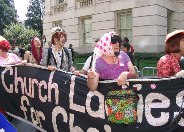 A photo of men dressed up as women carrying a banner saying: Church Ladies for Choice