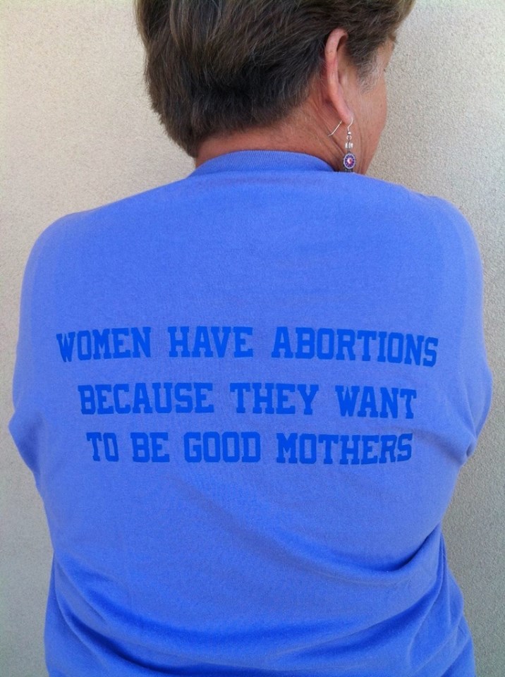 A photo of a women wearing a T-Shirt saying: Women have abortions because they want to be good mothers