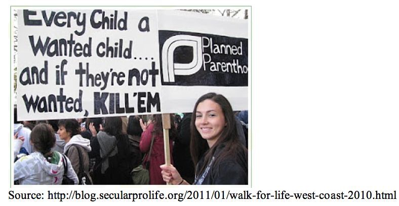 A photo posted by Secular Pro-Life blog of a female at a protest holding a sign that says: Planned Parenthood, Every Child a wanted child...and if they're not wanted, KILL'EM