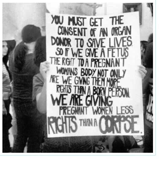 An old black and white photo of a protest sign that reads: You must get the consent of an organ donor to save lives. So if we give a fetus the right to a pregnant womans body not only are we giving them more rights than a born person, we are giving pregnant women less rights than a corpse.
