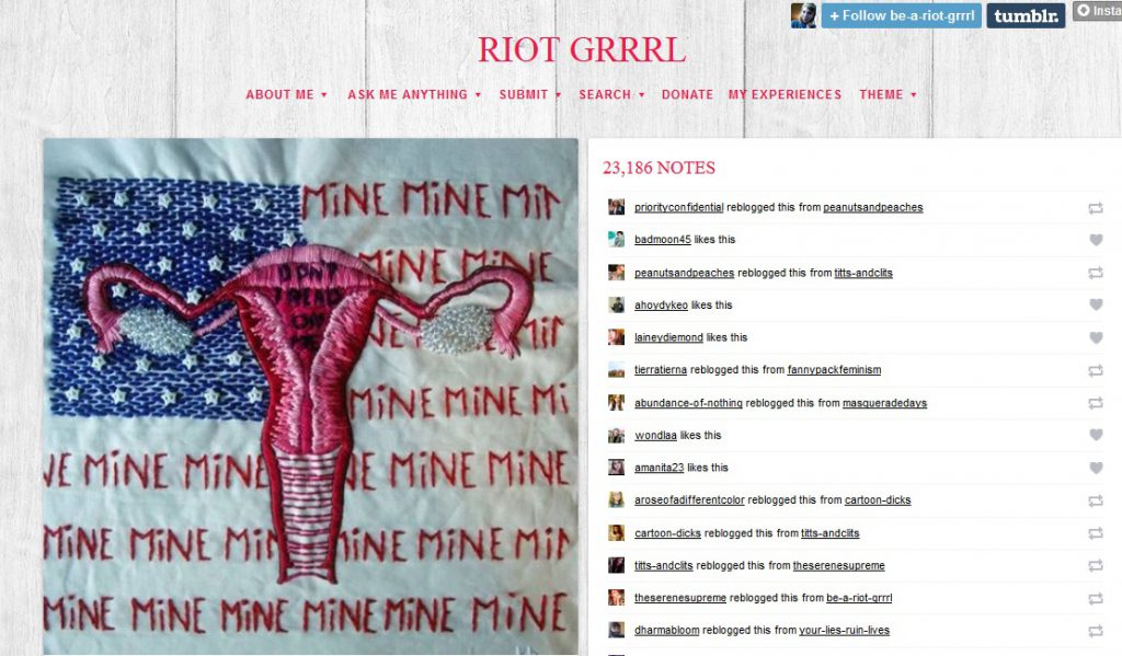 A photo posted on a blog called Riot Girl of an american flag but instead of the red strips it says the words MINE MINE repeated. Then a picture of a female reproductive system with the words Dont Tread On Me written inside the uterus