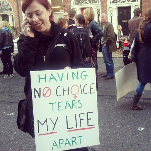 A women holding her protest sign that reads: Having NO CHOICE tears MY LIFE apart