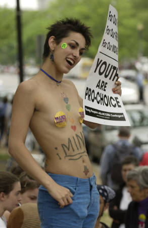 Naked female pro-choice protester with a sign that reads Youth are pro-choice