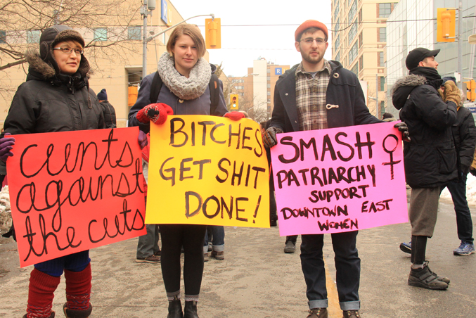 A picture of student protesters with signs that say: "C*nts against the c*nts, B*tches get sh*t done and Smash patriarchy support Downtown East Women"