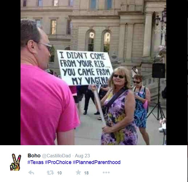 Pro-choice sign reads "I didn't come from your rib... you came from my vagina."