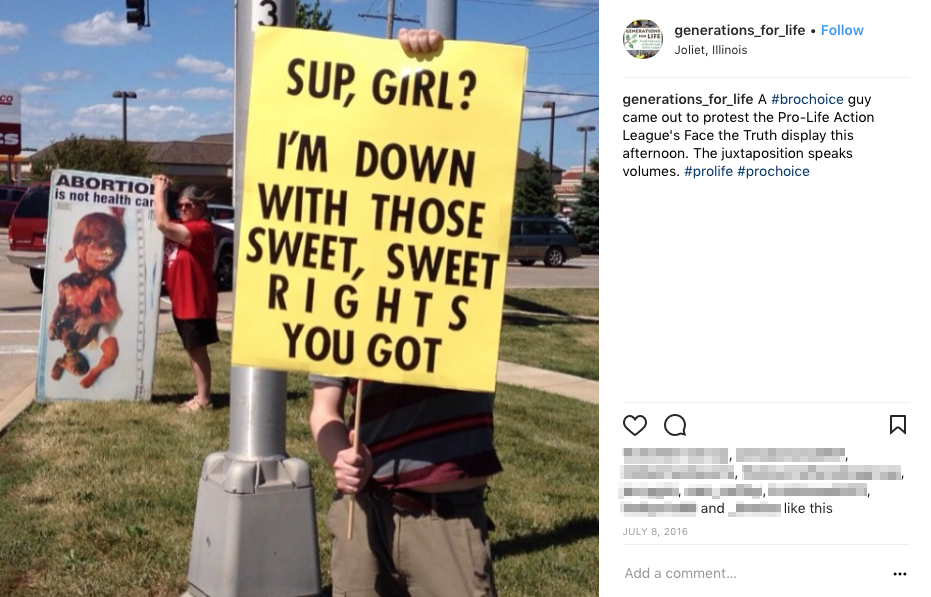 A bro-choice guy protests the Pro-Life Action League's Face The Truth Display. The man's sign reads, "Sup, Girl? I'm down with those sweet, sweet rights you got."